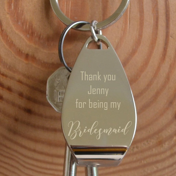 a personalised engraved bottle opener keyring with the message "thank you Jenny for being my bridesmaid"